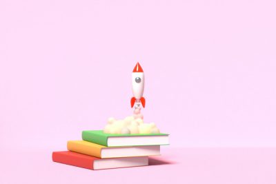تصویر راکت و کتاب - Toy rocket takes off