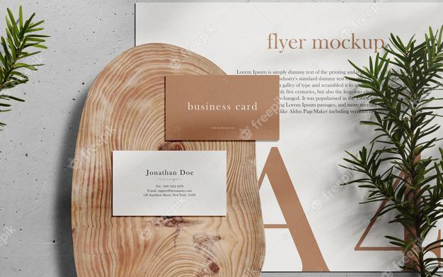 موكاپ بیزینس کارت - Clean minimal business card and a4 mockup on wooden plate with conifer